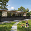 Black extra wide retractable mesh gate across a garage doorway