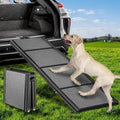 71 inch folding dog ramp with non-slip surface leaning on an SUV