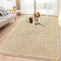 Beige solid chenille dog door mat at a front door