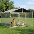 Outdoor dog enclosure kennel set up on a backyard lawn