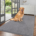 Grey chenille dog mud mat in an indoor entryway