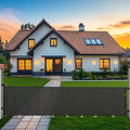 Gray retractable mesh dog gate stretched across a wide indoor opening