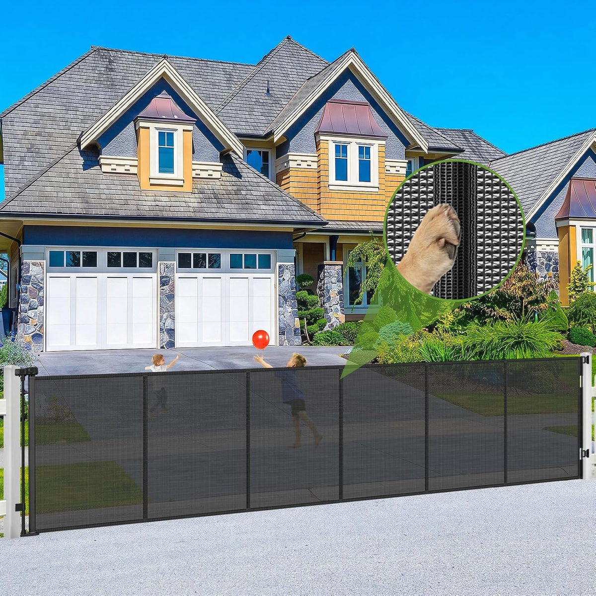 Black extra wide outdoor retractable mesh pet gate on a patio