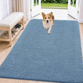 Airy blue chenille muddy paw mat inside a front door