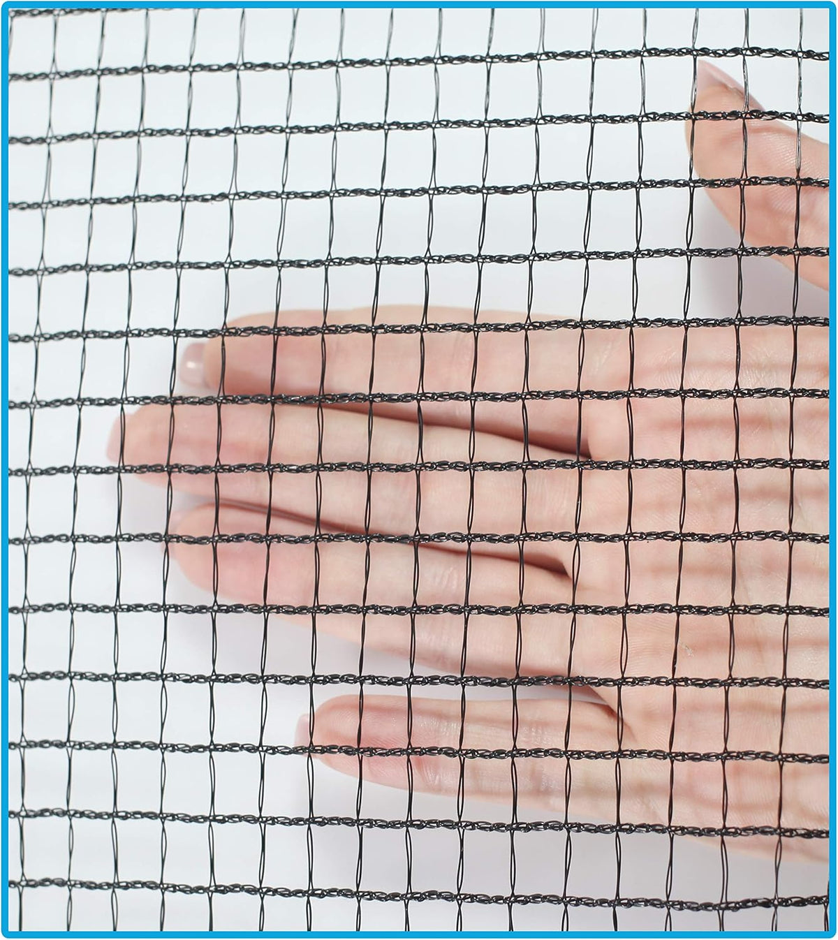 Black retractable caution net stretched across a two-car driveway