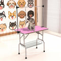 Pink foldable dog grooming table with adjustable arm and mesh tray