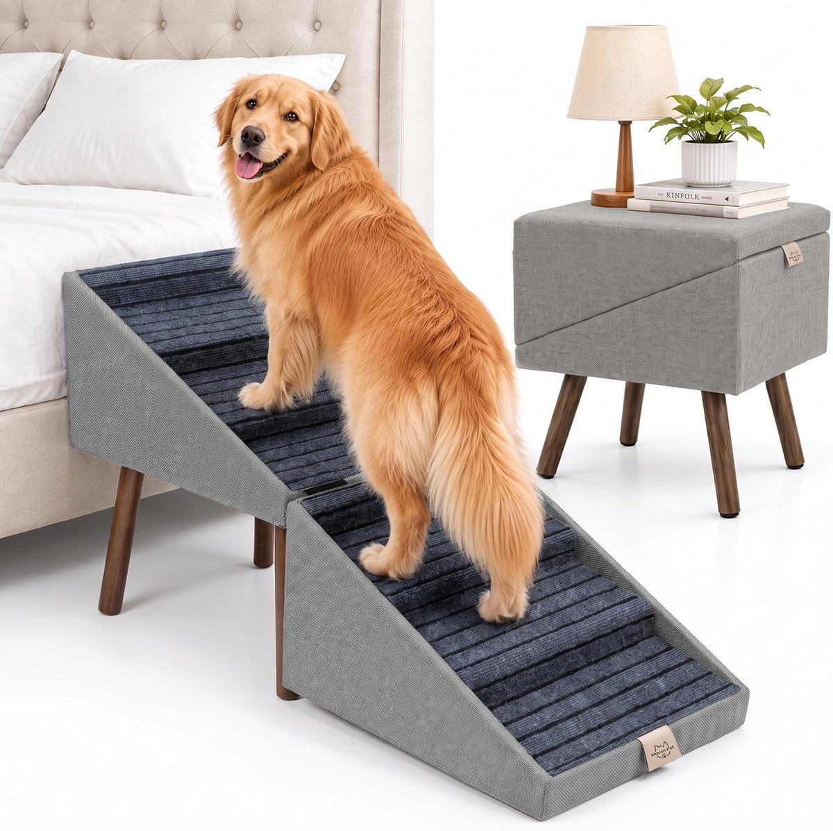 Wooden ottoman-style dog stairs with six fabric-covered steps beside a bed