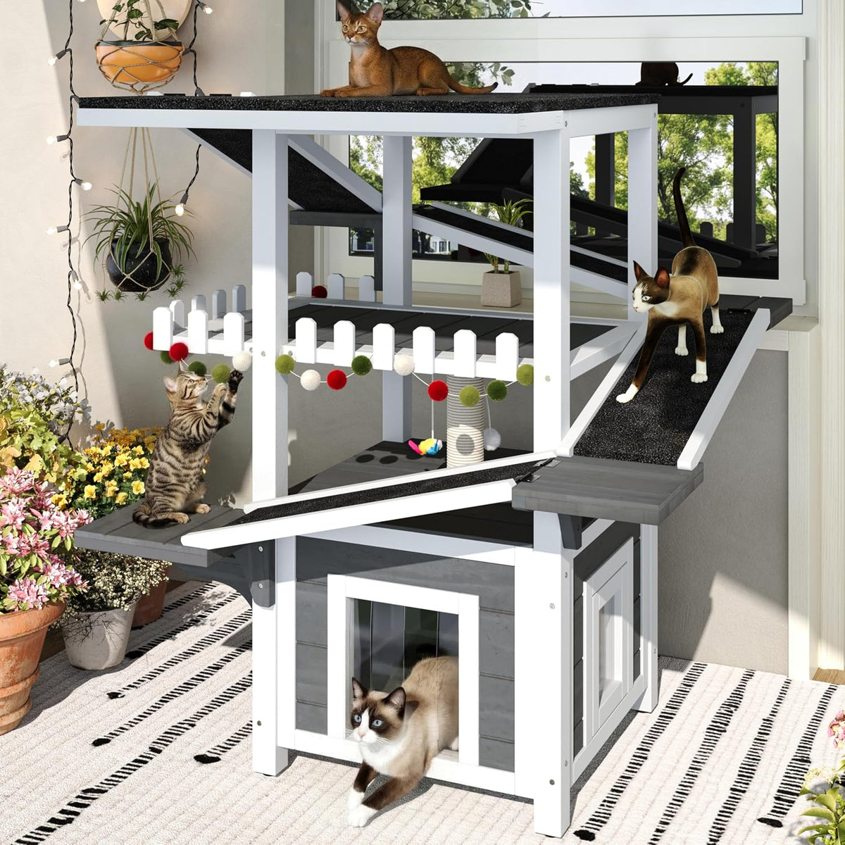 Grey and white four-tier outdoor cat house with enclosed shelter, balcony and scratching posts